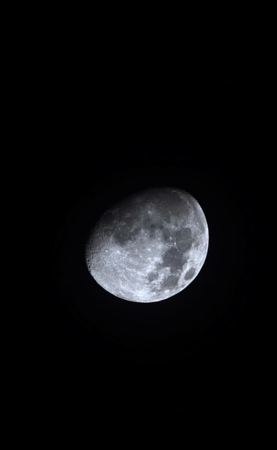 Dash's portrait photograph of the bright gibbous Moon against a black sky