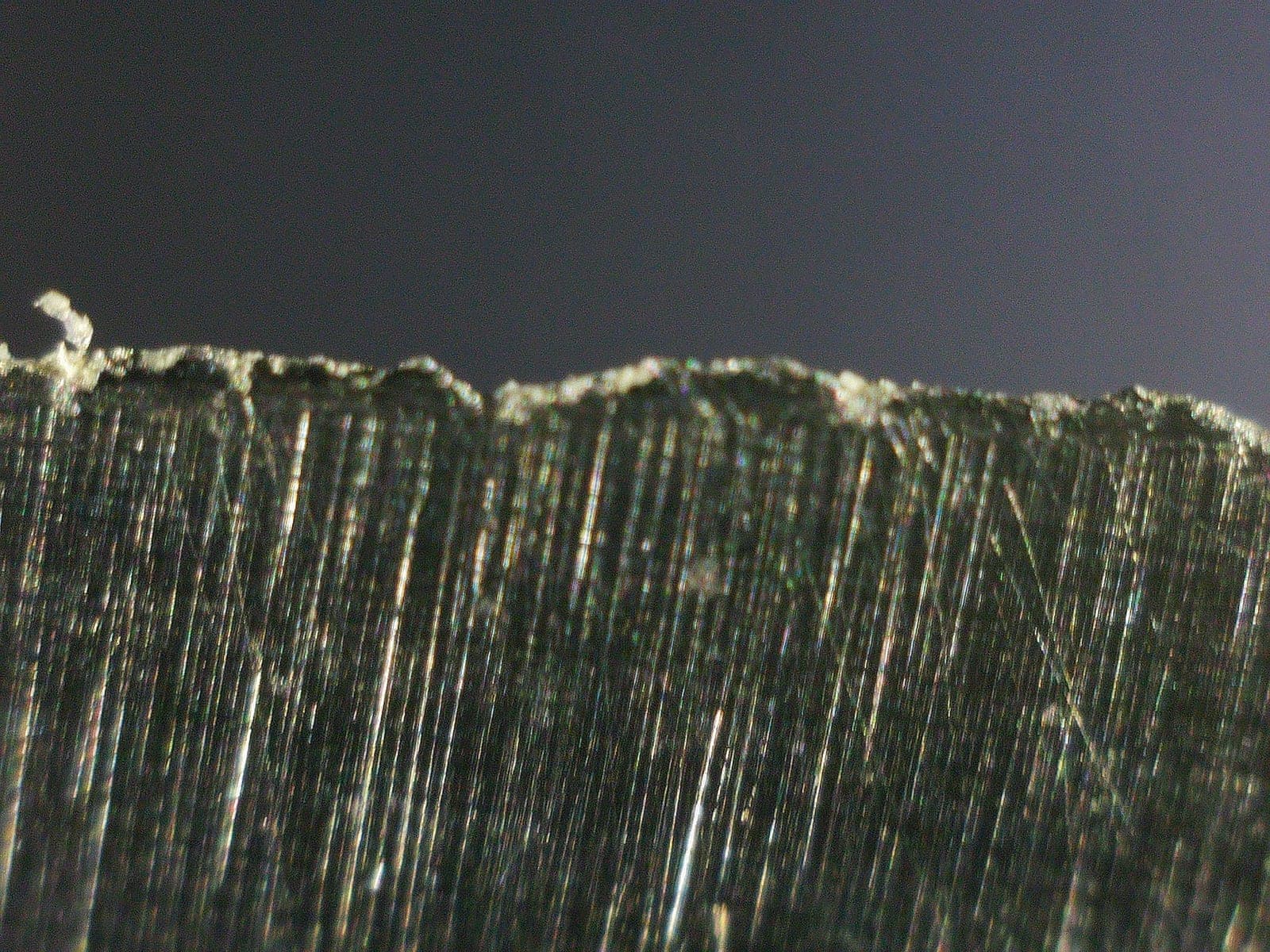 Digital microscope view of a ragged knife edge before sharpening